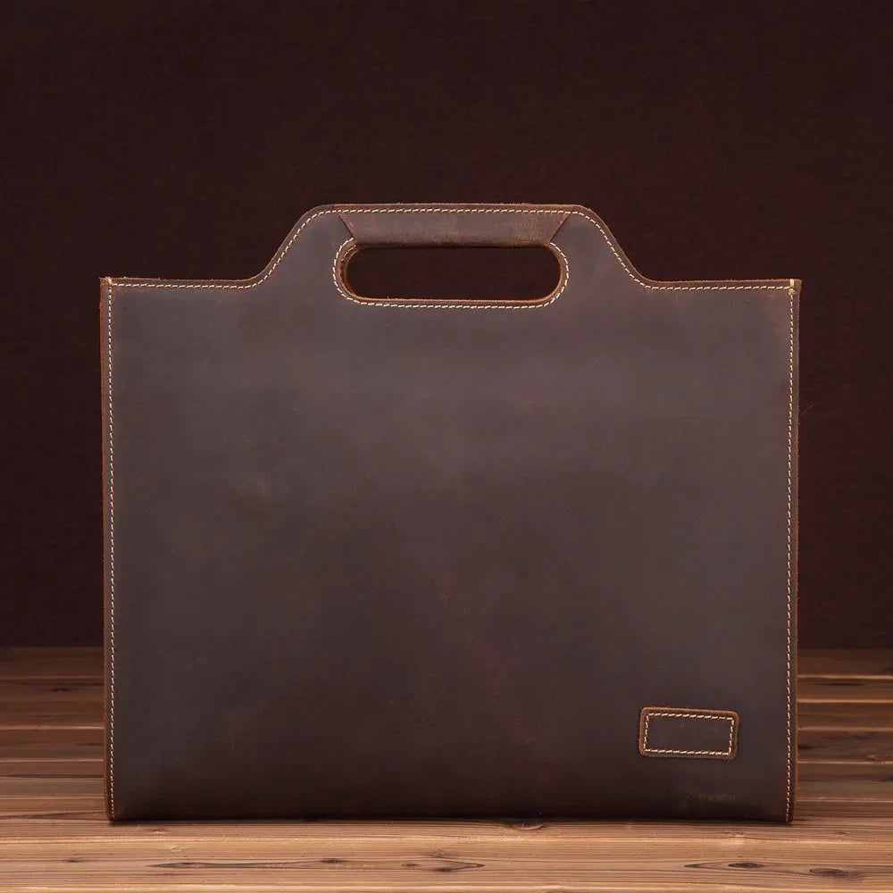 Brown leather briefcase with stitching details, and minimalist design, perfect for business use, front view.