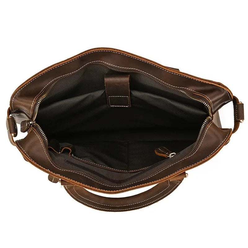 Interior of a stylish brown leather bag, showing ample storage space and interior pockets.