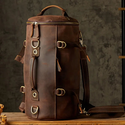 Brown leather duffle bag, with detachable straps and soft handles and a robust and versatile design, front view.