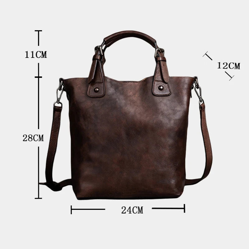 A brown leather handbag with handles, measuring 24CM wide, 28CM high and 12CM deep, front view.