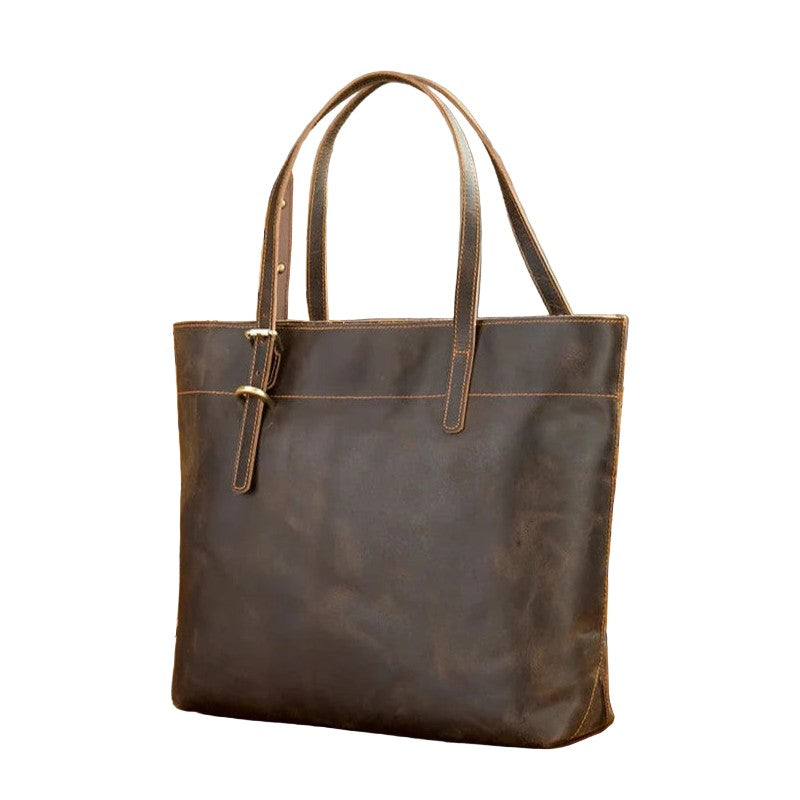 Brown leather tote bag on a white background, front view.