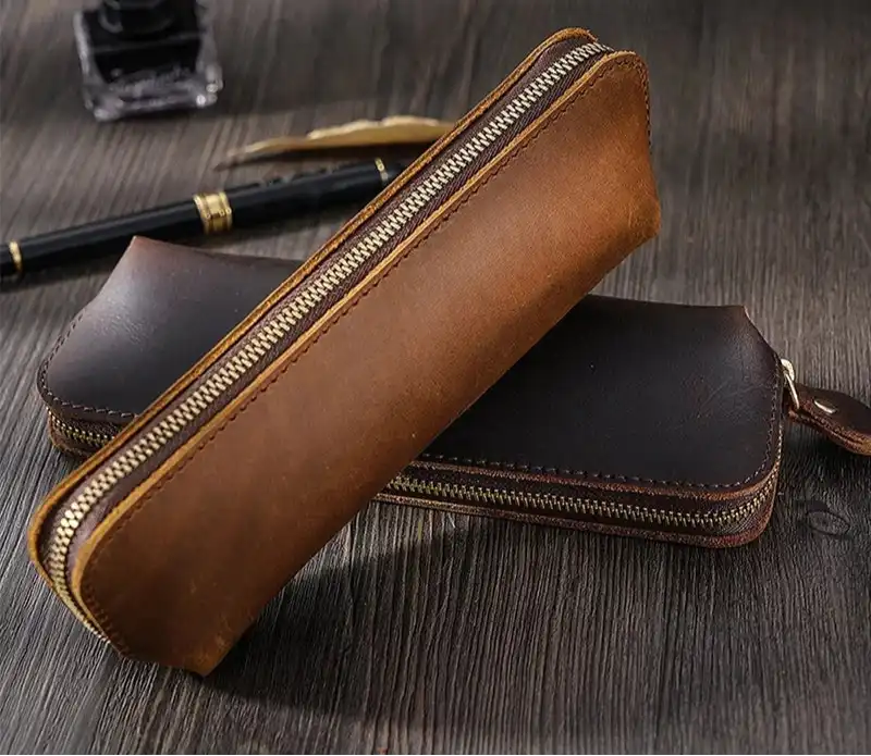 2 elegant brown leather cases with classic design, front view.