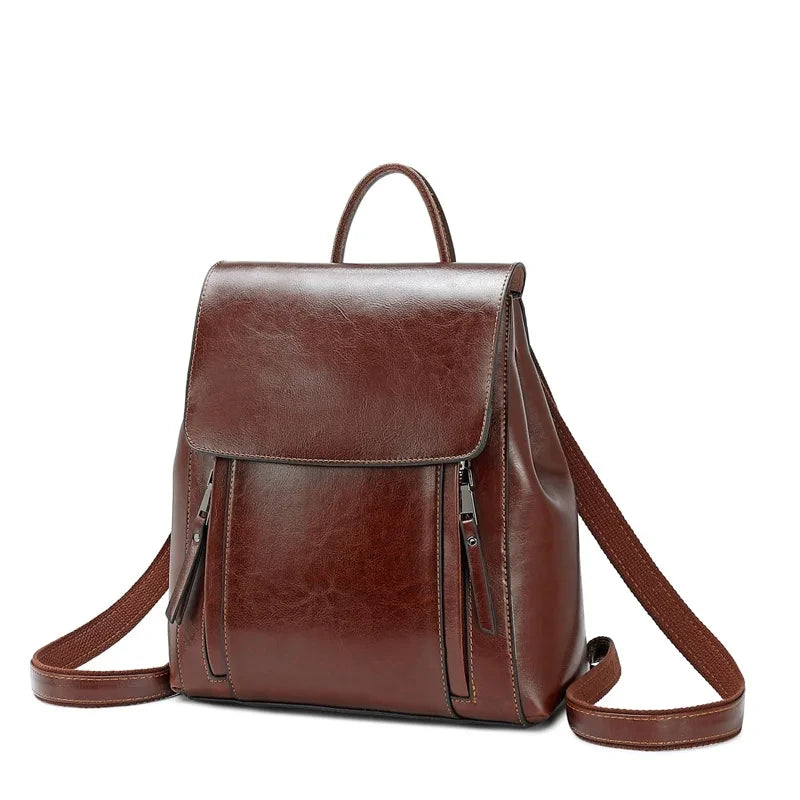 Stylish coffee brown leather backpack with zipper pockets, adjustable straps and soft handle - front view