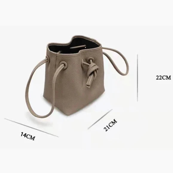Modern gray leather bucket bag with dimensions 22cm height, 21cm width, and 14cm depth.