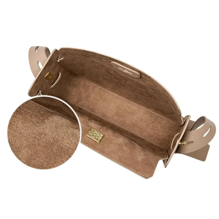 Interior of a beige leather women's bag, showing its spacious interior with elegant details.