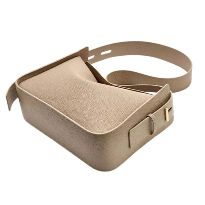 Gray leather bag with adjustable strap and modern, elegant design, top view.