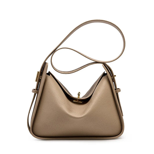 Elegant gray leather bag, with a modern design and long adjustable strap creating a casual look, front view.