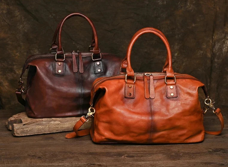 display of two elegant leather bags, one in a dark brown and vibrant caramel shade, highlighting their sophistication and style.