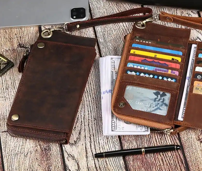 elegant brown leather wallet and card holder displaying various cards and cash on a wooden background.