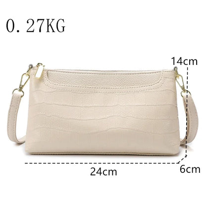 Women's leather bag with an elegant design, measuring 24cm x 14cm x 6cm.