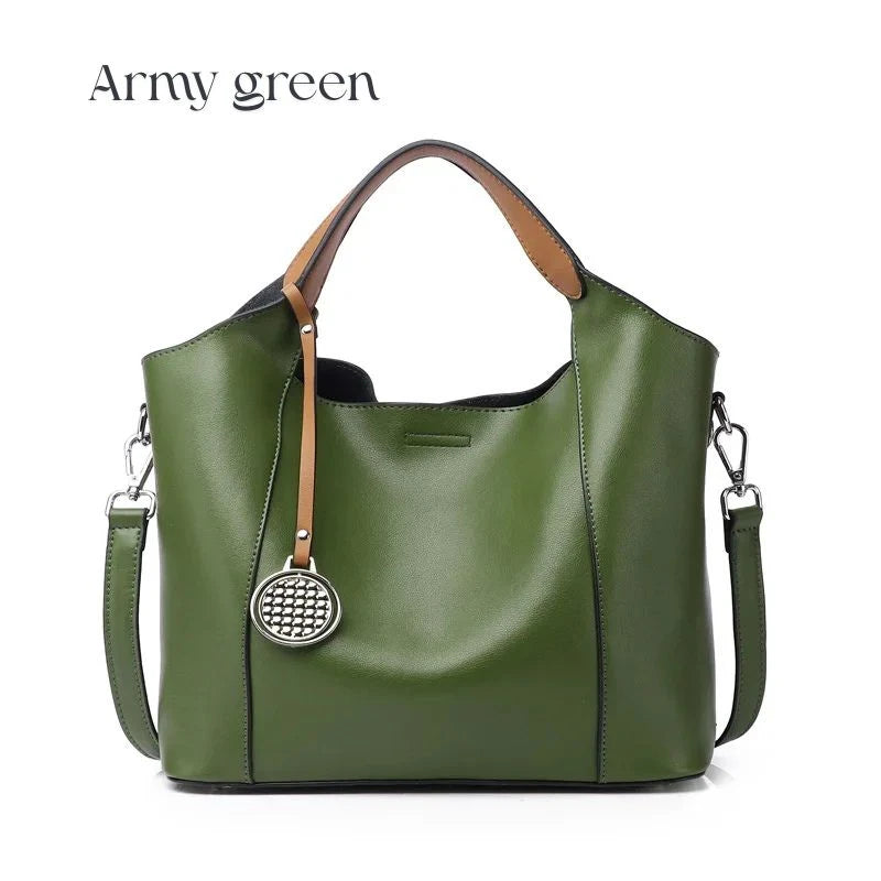 Army green leather bag with soft detachable handles and elegant charm, front view.