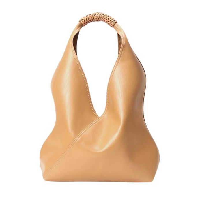 Gold leather bag with unique design and braided handle, front view.