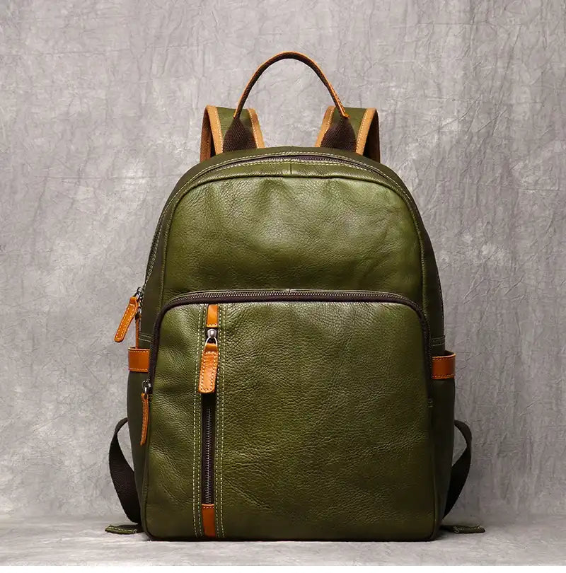 Fruit green leather backpack, with an elegant finish and practical front compartments, front view.