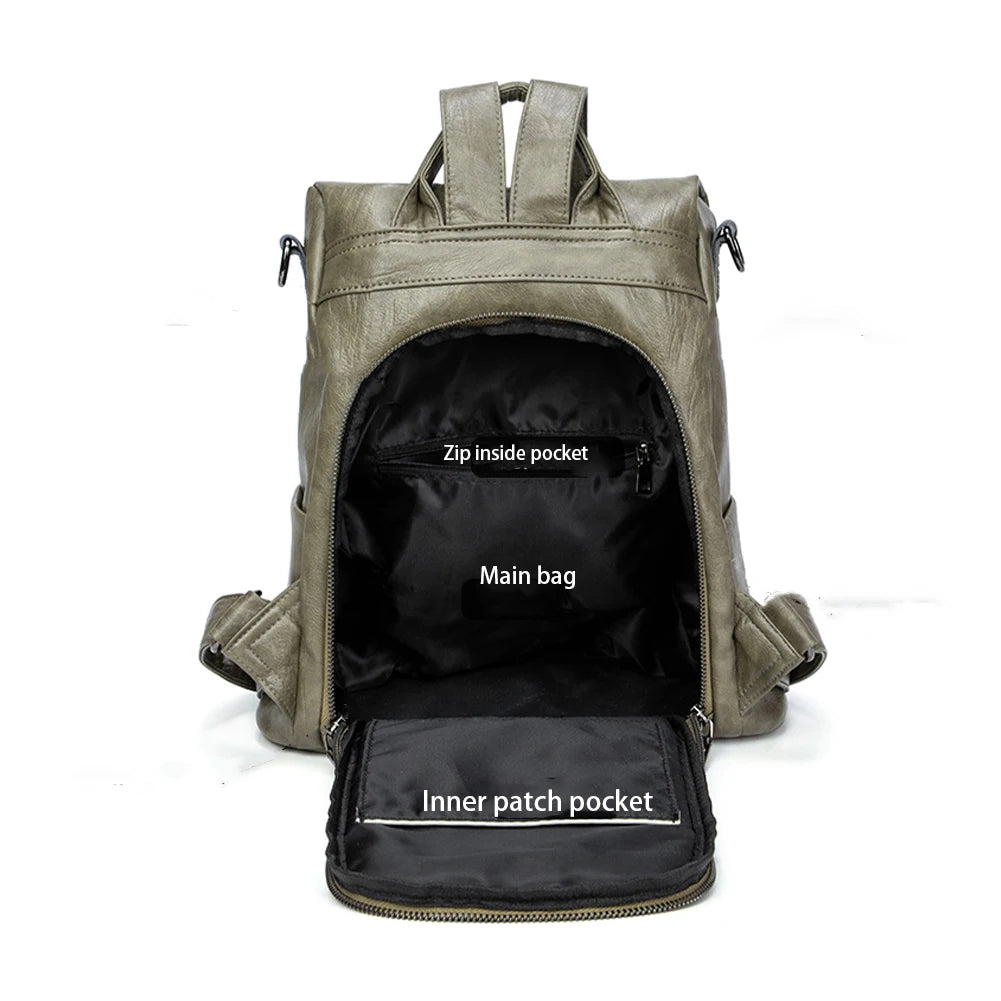 Interior view of a stylish green leather backpack showing main compartment and interior pockets.
