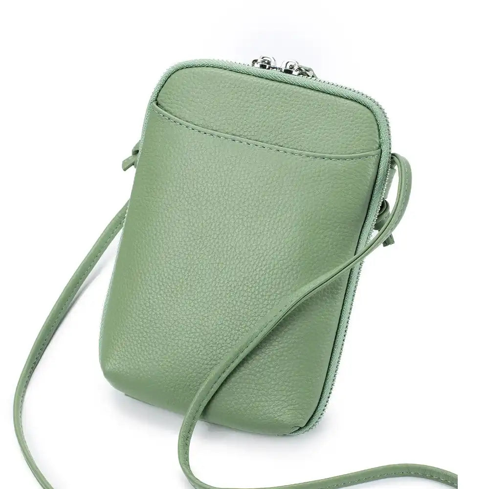 Stylish green leather crossbody bag with a sleek design and leather strap - front view.