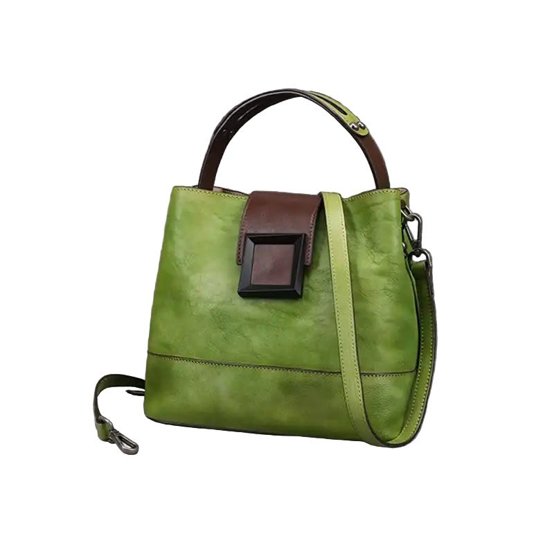 Green leather handbag with brown accents on a white background, front view.