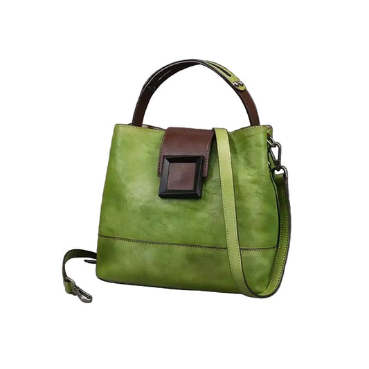 Green leather handbag with brown accents on a white background, front view.