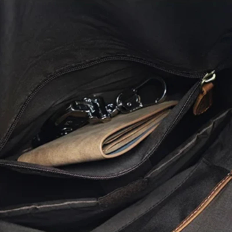 Inside view of a bag, with notebooks and keys in internal pocket.