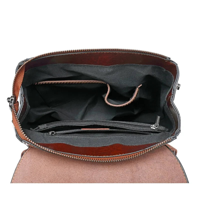 Spacious interior of a leather bag showcasing organized pockets and compartments.