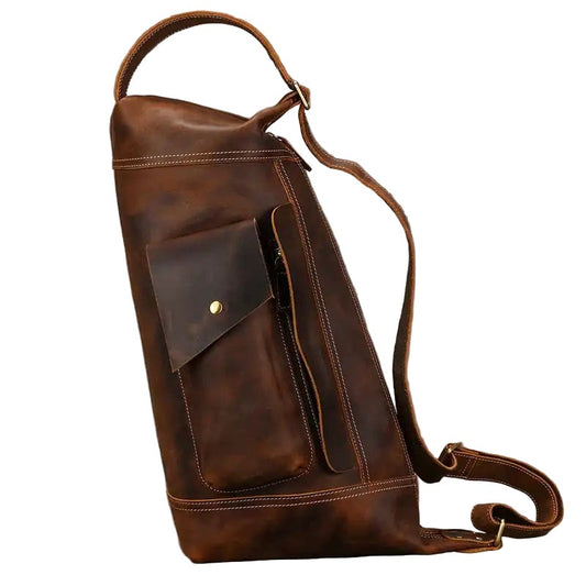 Brown leather shoulder bag with a pocket on a white background, front view.