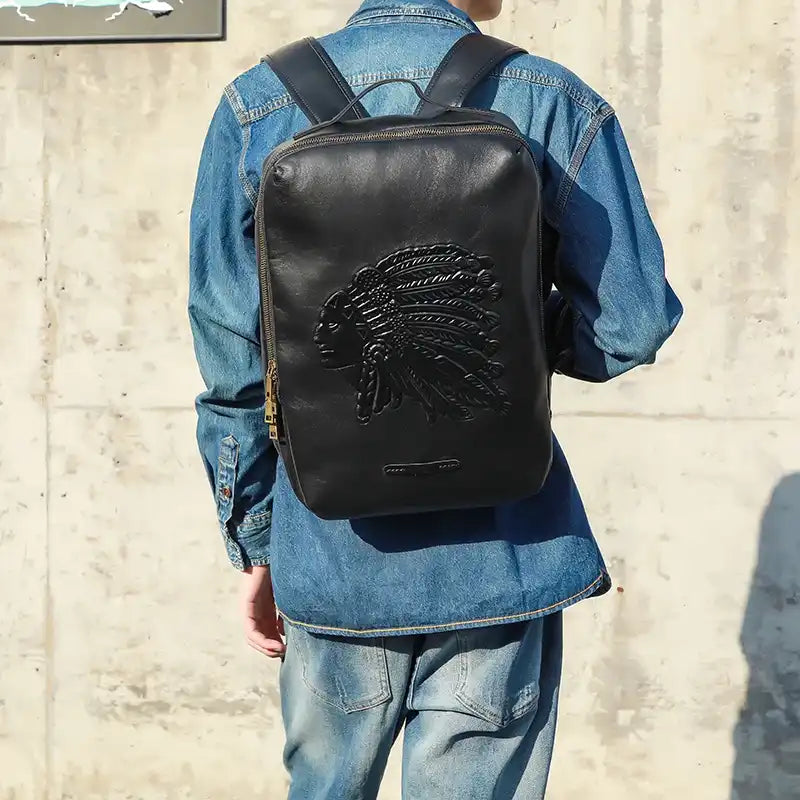 Stylish black leather backpack featuring a Native American embossed design on the back.