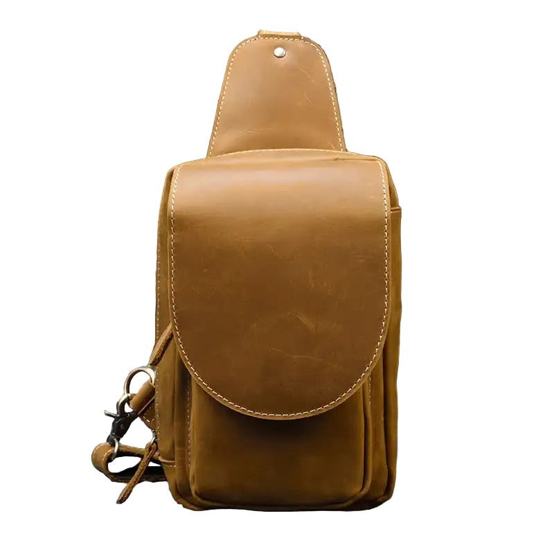 Brown leather crossbody bag on a white background, front view.