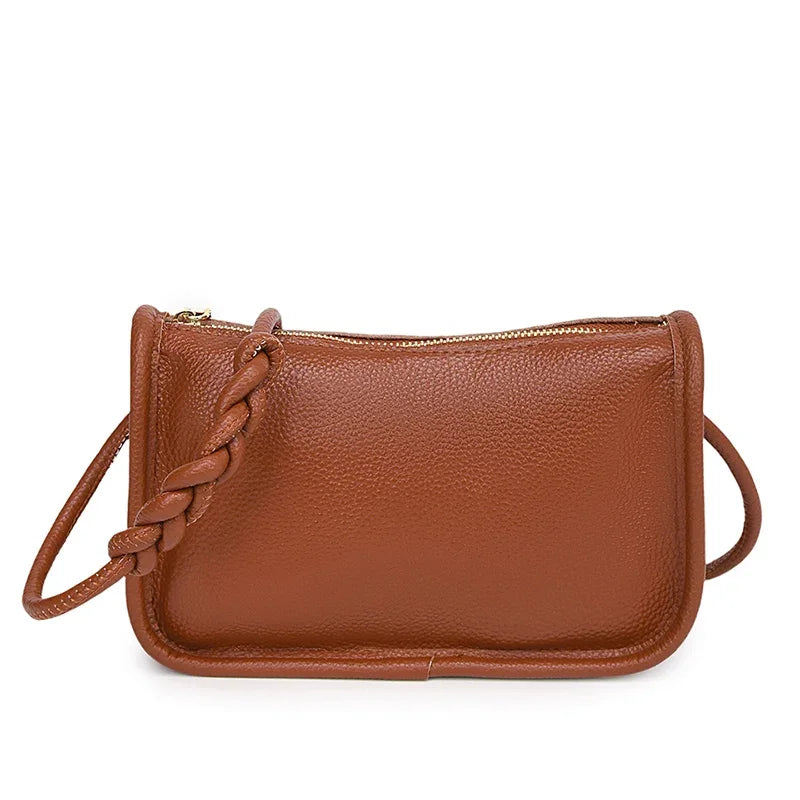 Stylish brown leather crossbody bag with braided strap - front view.