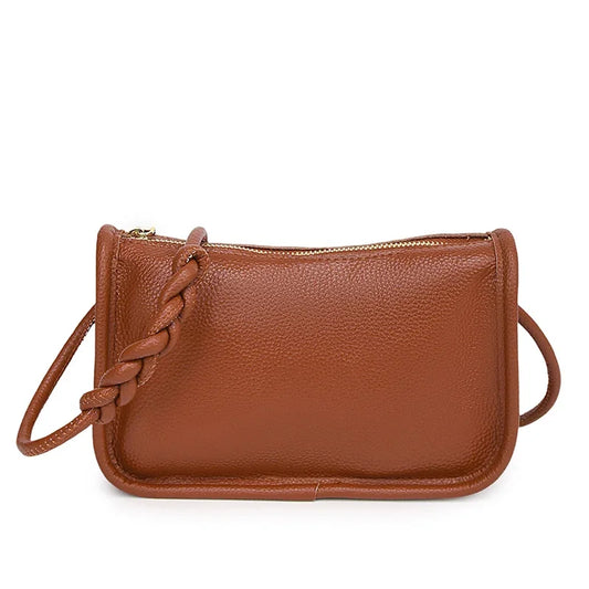 Stylish brown leather crossbody bag with braided strap - front view.