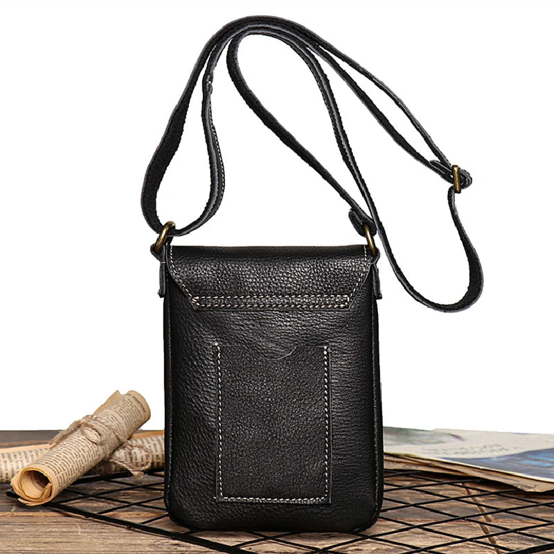 Vintage black leather mini shoulder bag with adjustable strap - back view