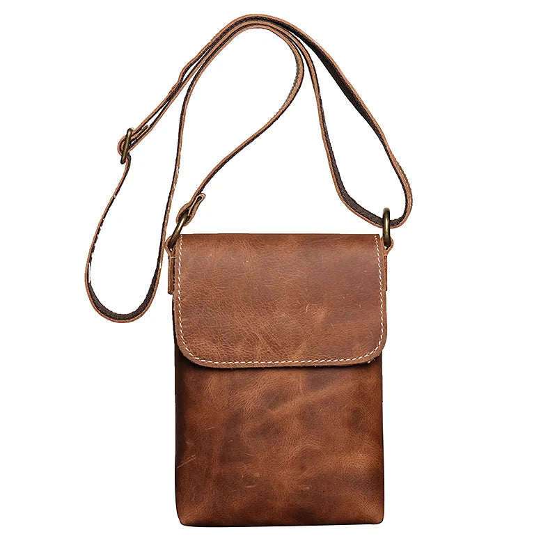 Vintage brown leather mini shoulder bag with adjustable strap - front view