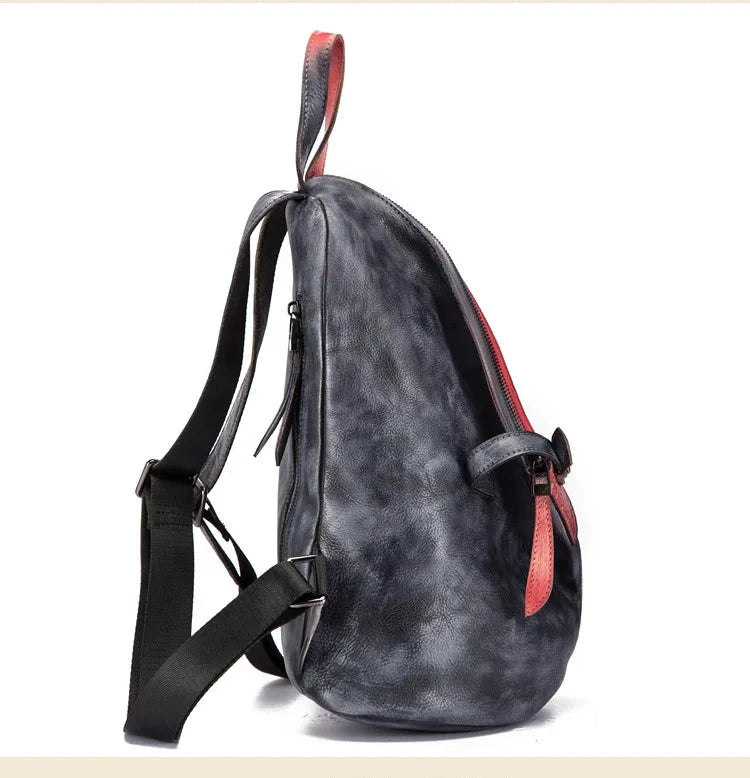 side view of a black and red leather backpack featuring a sleek design and straps.