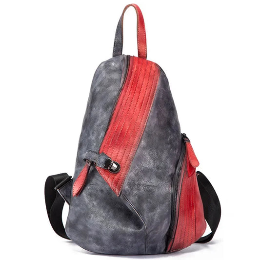 A unique leather  backpack showcasing a blend of red and black colors - front view.