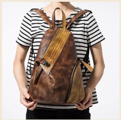 Modern patchwork backpack in yellow & brown worn by a woman, showcasing a chic design.