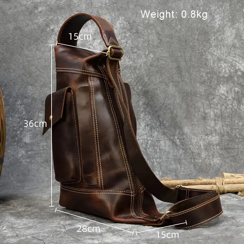 back view of a brown leather shoulder bag with dimensions.