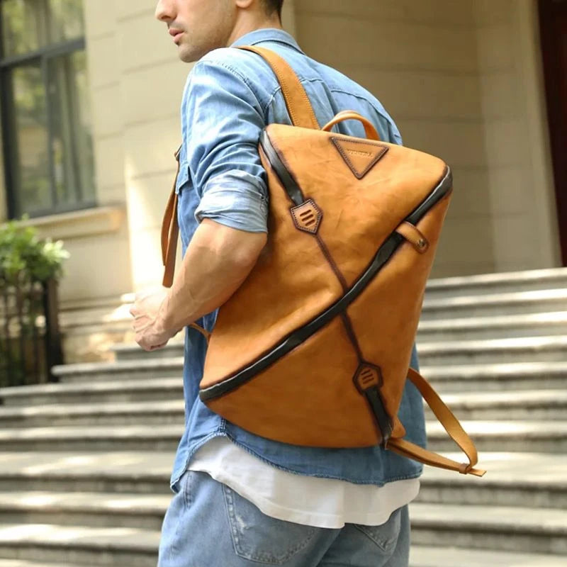 Man wearing a stylish brown vintage  leather backpack with unique design,on shoulder.