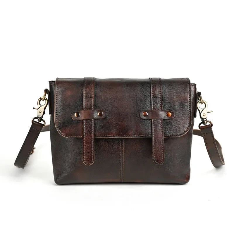 A chic dark brown leather shoulder bag featuring a flap closure and minimalist design - front view.