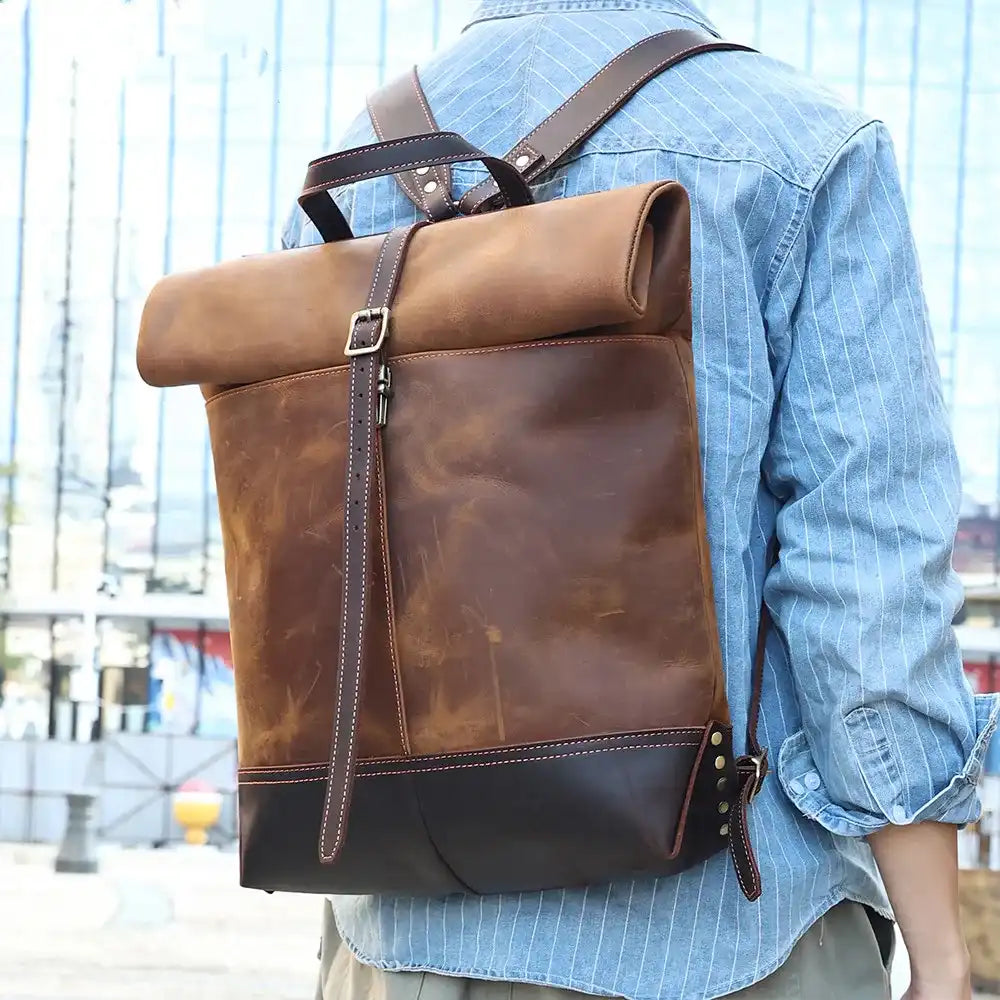 Stylish and modern leather backpack, worn on the back of a model. 