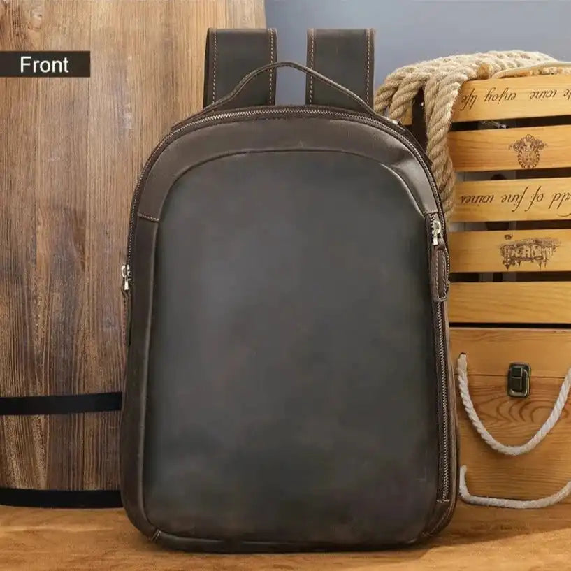 Brown leather backpack front view, highlighting its elegant and minimalist design.