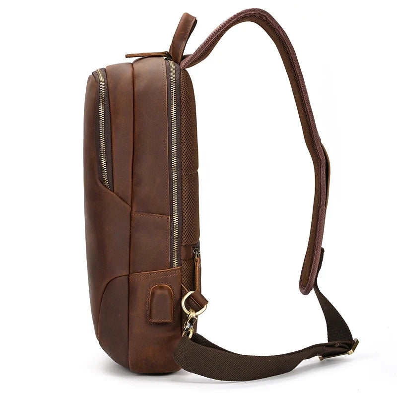 elegant brown leather shoulder bag with a modern design, adjustable strap, and soft handle - side view.