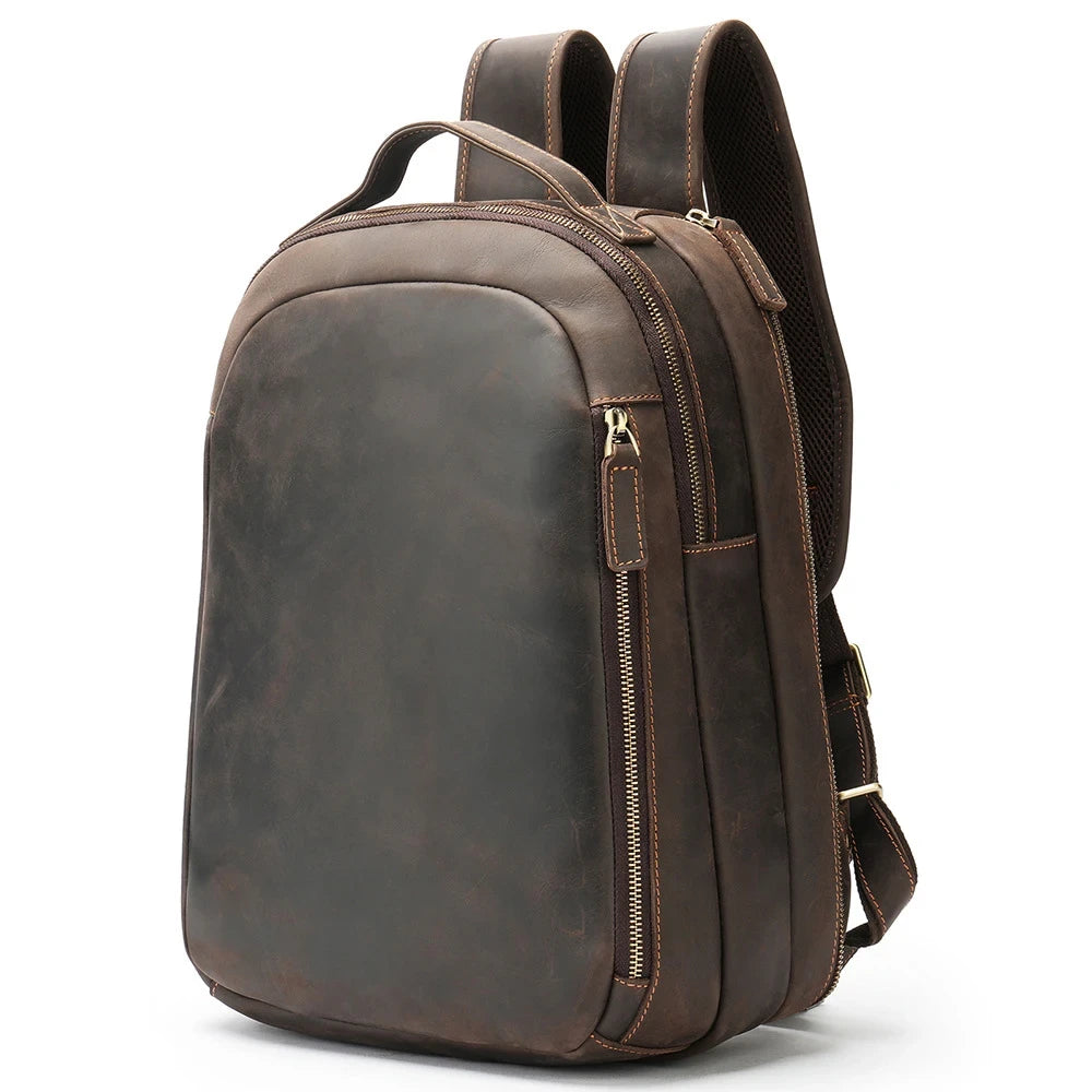 Stylish brown leather backpack with adjustable straps, soft handle and multiple compartments, front view.