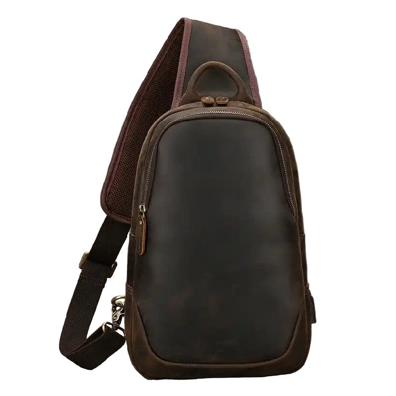 Stylish dark brown leather sling bag on a white background, front view.