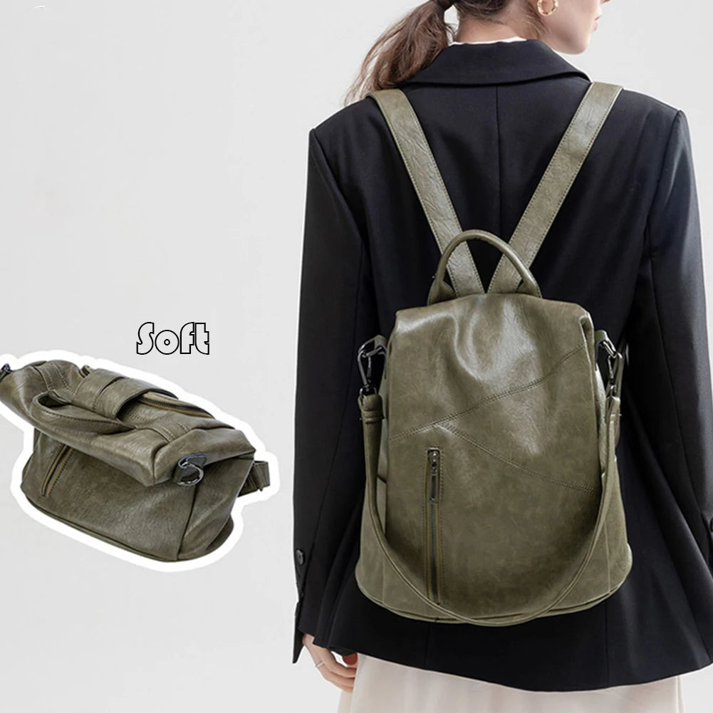 A fashionable green leather backpack worn by a model, showcasing its soft texture and modern design.