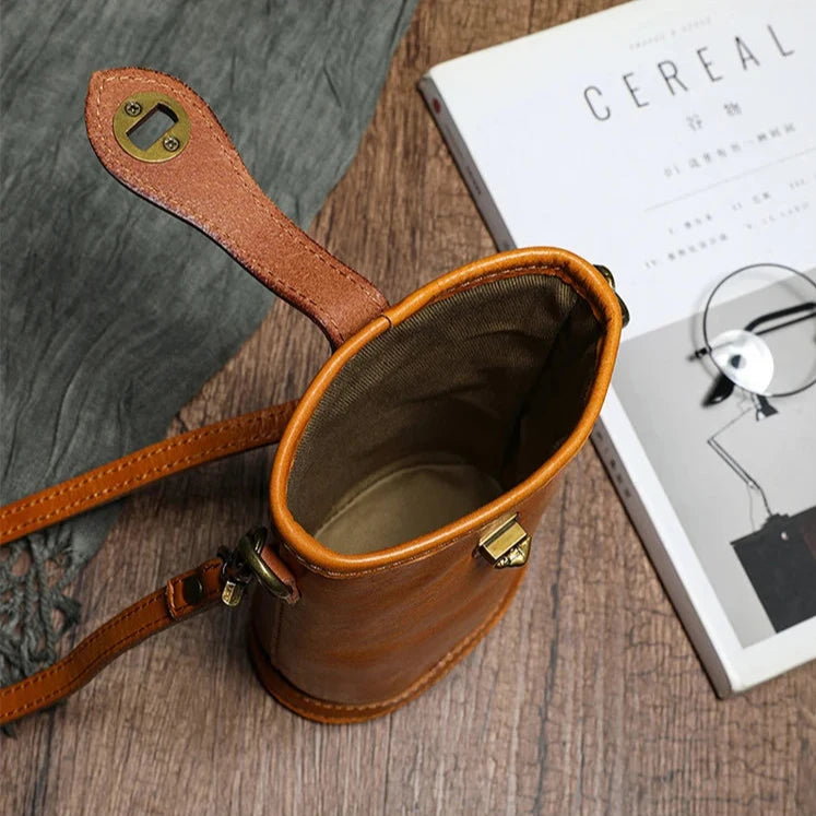 Interior view of a brown leather crossbody bag showcasing its spacious design.
