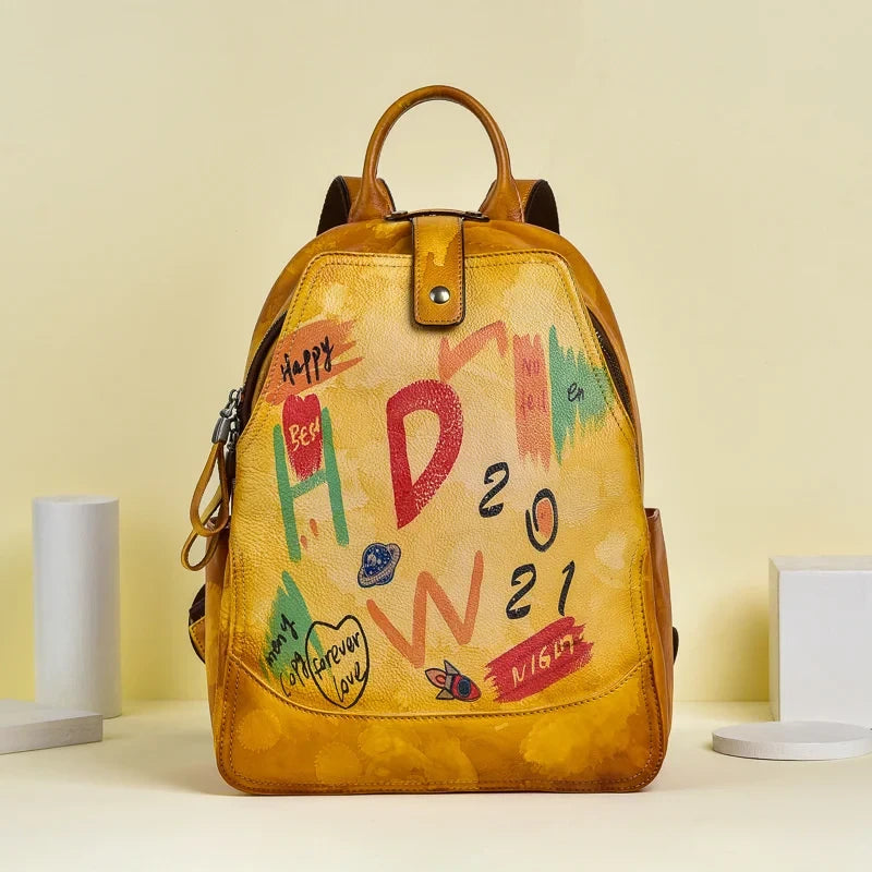 Orange leather backpack with an artistic design filled with vibrant colors and drawings.