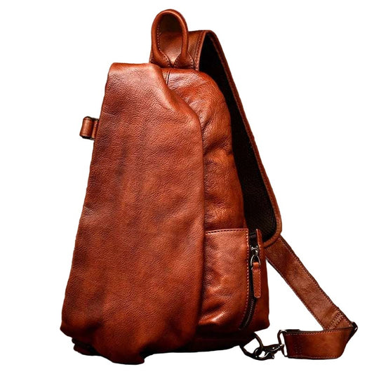 Organic shape brown leather shoulder bag for men, front view.