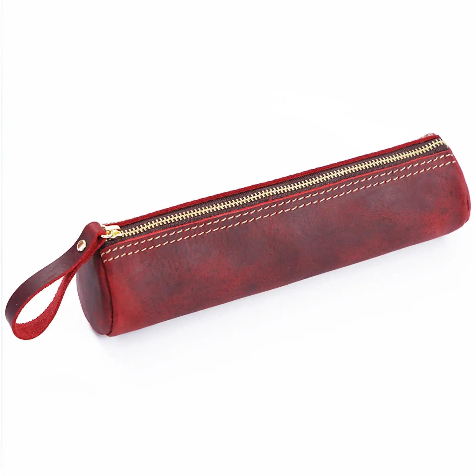 red leather pencil case with zipper, leather handle and fine stitching details, front view.