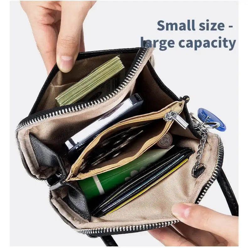 Inside view of a small leather bag with organized compartments and daily items demonstrating capacity.