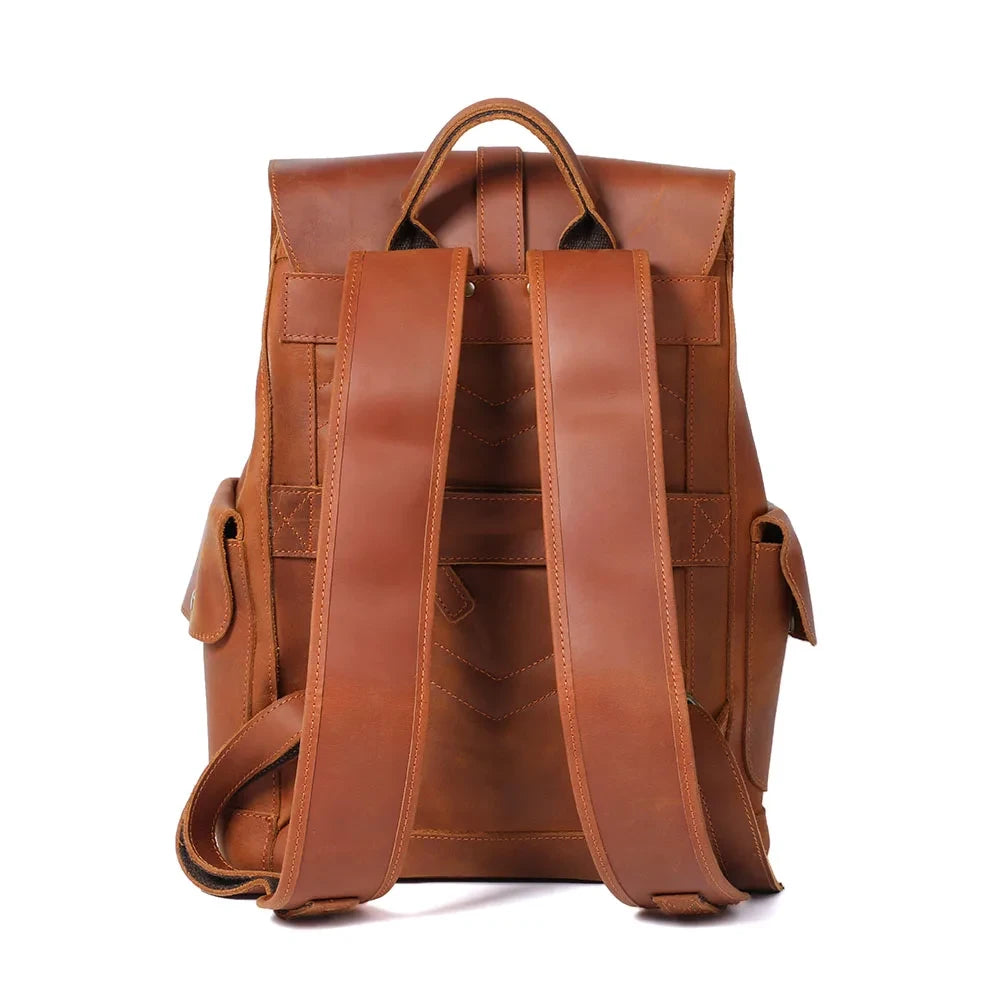 Vintage brown leather backpack with adjustable straps - back view.