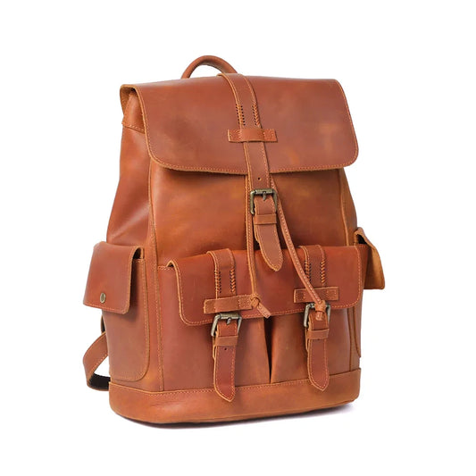Front view of an elegant brown leather backpack, ideal for travel, with buckle, stitching details and pockets.