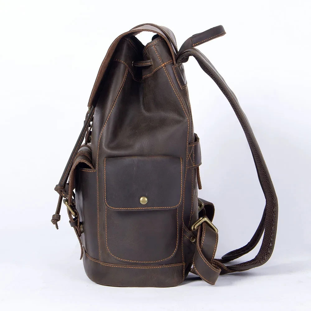 Dark brown leather backpack with side pockets, ideal for daily use or travel, offering style and practicality - side view